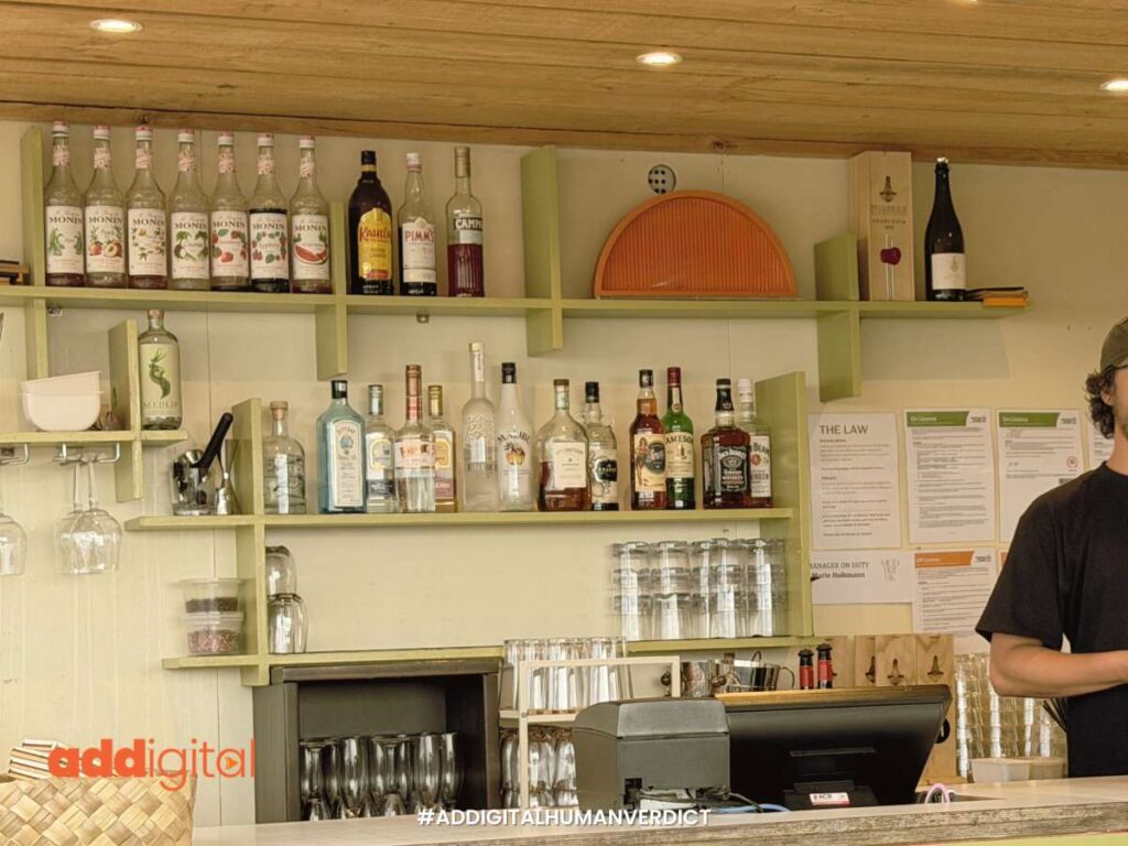 Close-up of an authentic hospitality interior featuring local NZ licensing documents and a real-world business environment, demonstrating 'Experience' over generic AI-generated stock photos