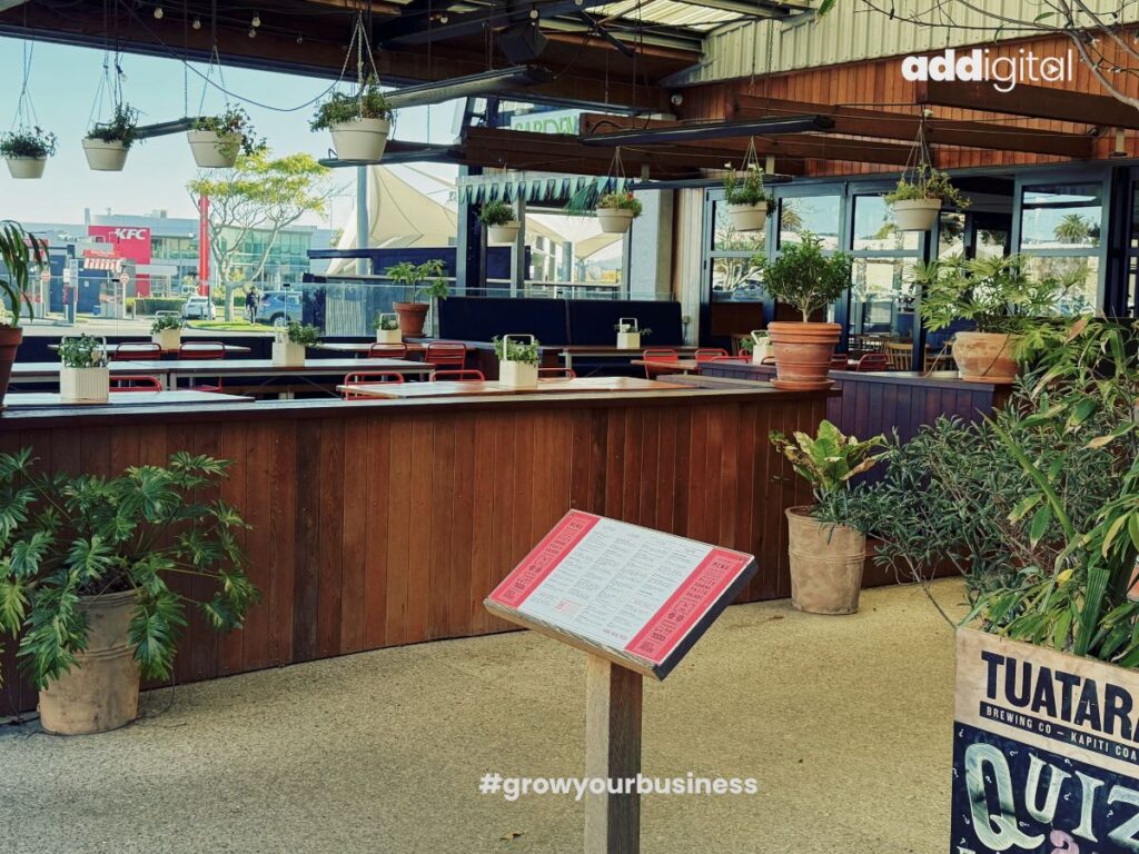 Outdoor dining area of a modern Auckland restaurant, illustrating how customers make choices between similar local businesses.