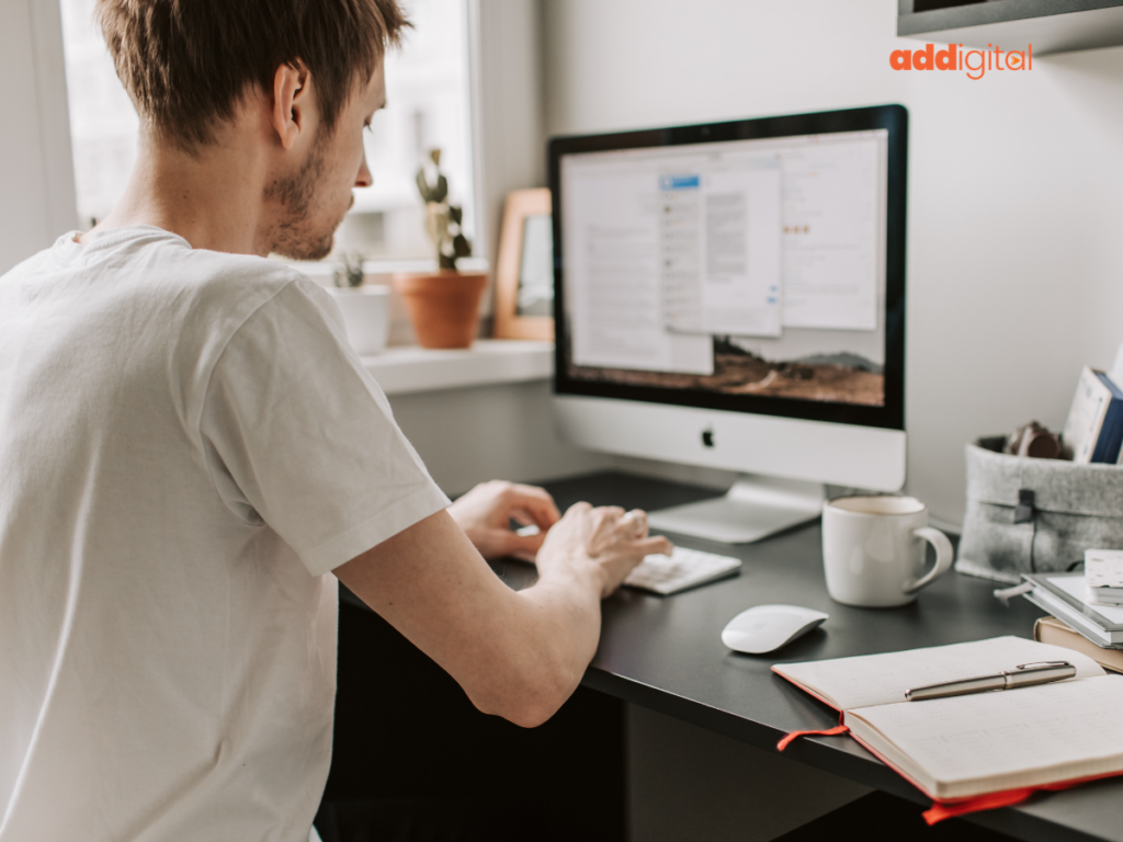 A New Zealand small business owner planning their marketing strategy while considering Google Ads and Meta Ads at a modern workspace.