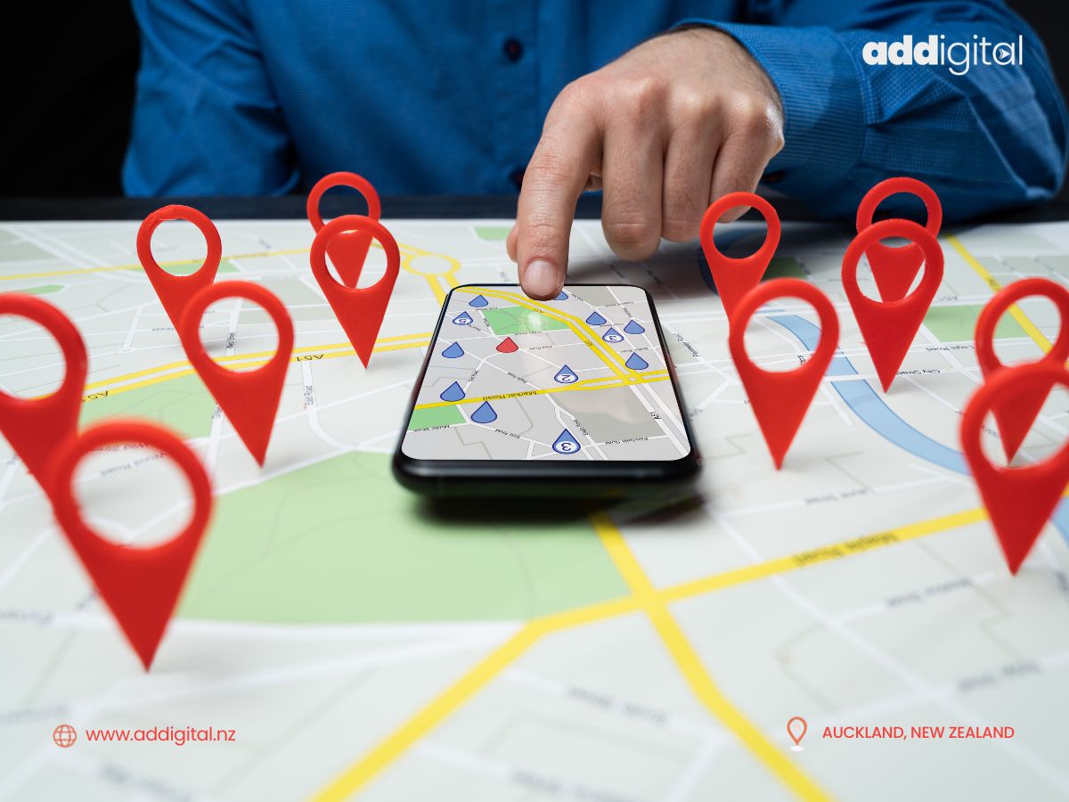 Person using a smartphone map surrounded by location pins, representing how customers find local small businesses online.