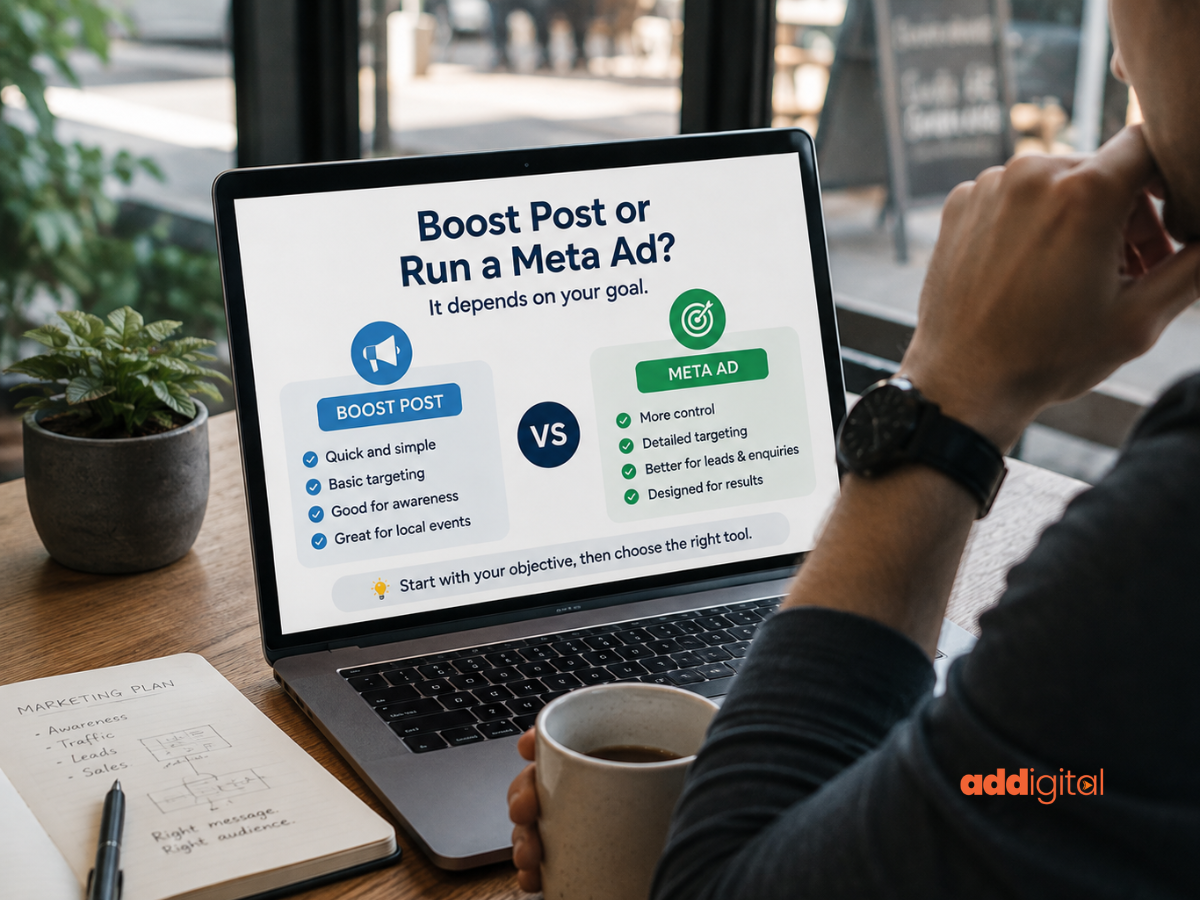 A New Zealand small business owner planning a social media advertising strategy while comparing boosting a Facebook post with running a Meta advertising campaign.