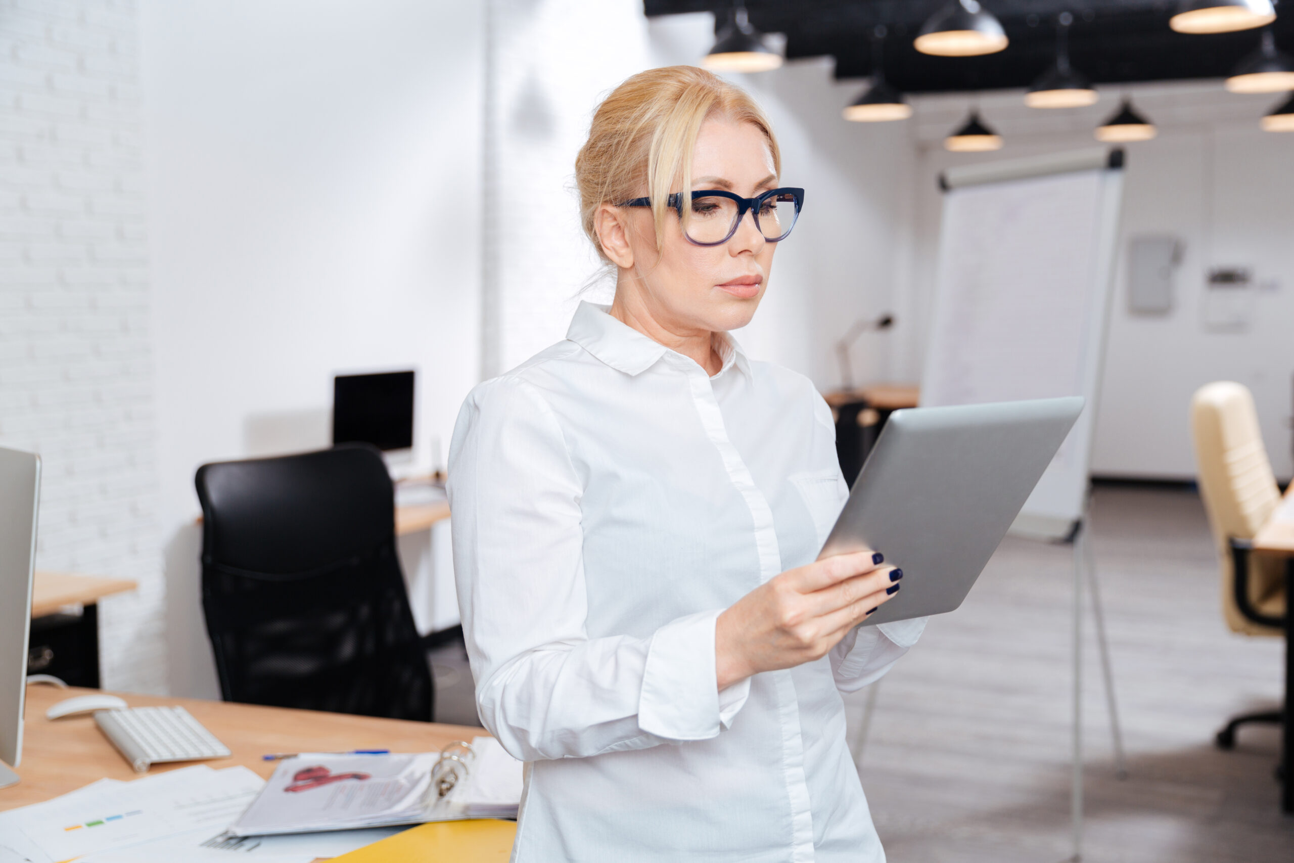 Small business owner reviewing marketing plans before deciding on a Google Ads budget
